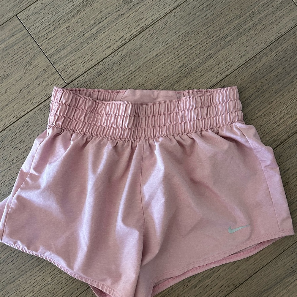 Pink Nike running shorts